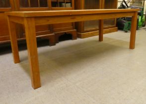 A 1970s teak framed ten tile top coffee table, raised on square legs  17"h  46"w