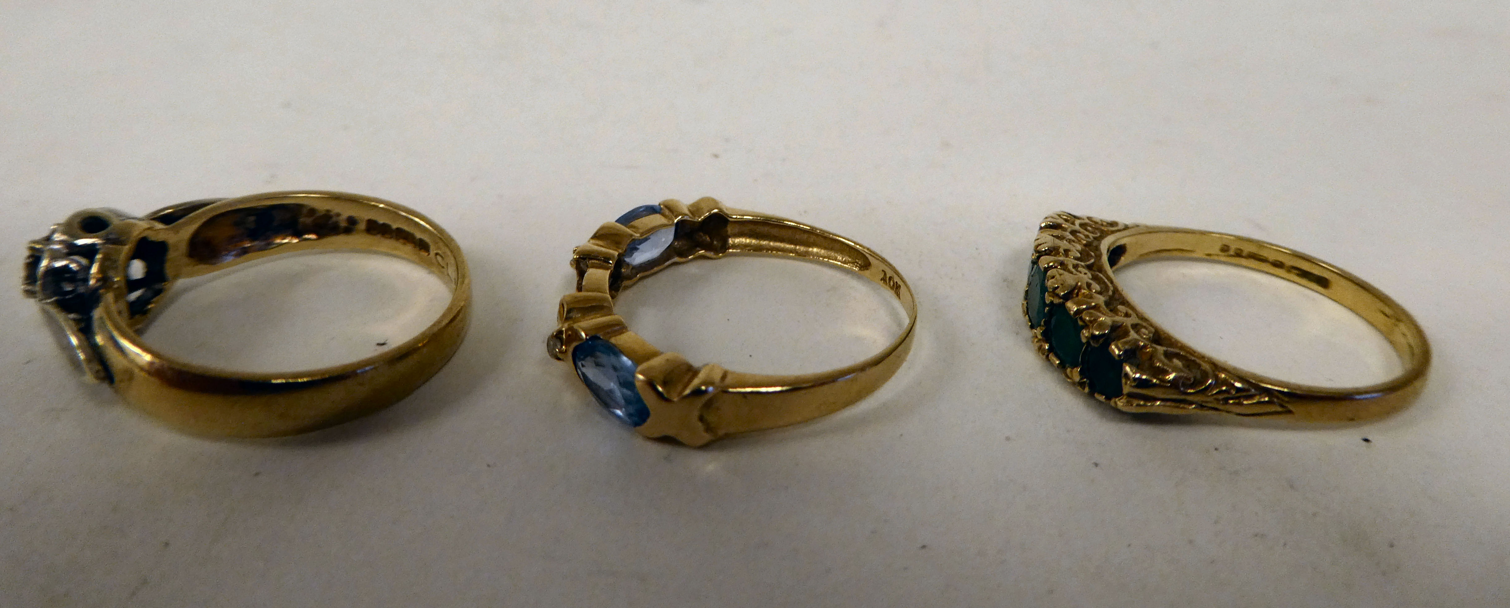 Three variously designed, 9ct gold rings: to include one set with aquamarine coloured stones - Image 2 of 3