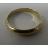 A gold coloured metal wedding ring  stamped 835