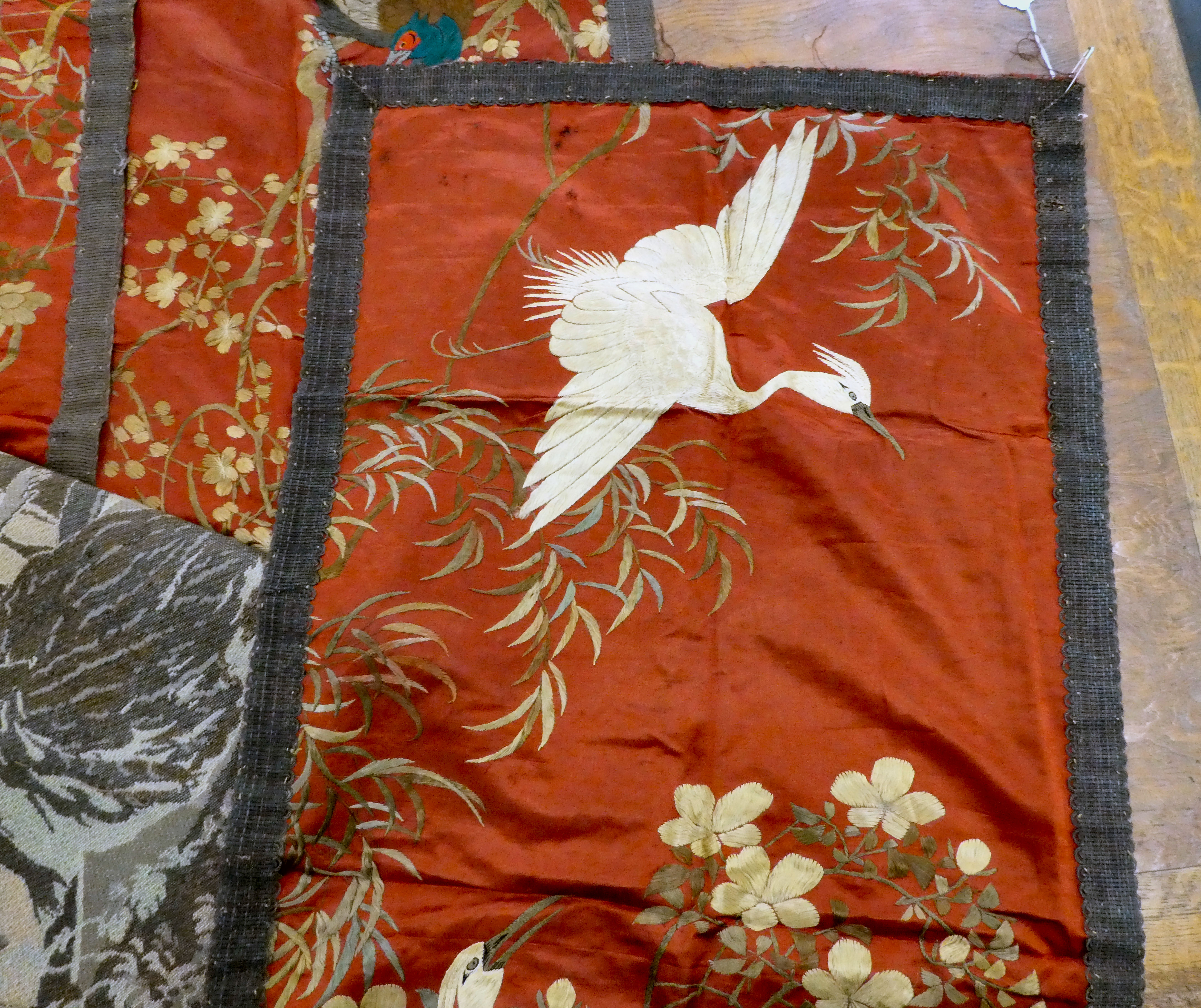 Textiles: to include a set of three early 20thC Chinese embroidered panels, depicting birds  45" x - Image 2 of 7