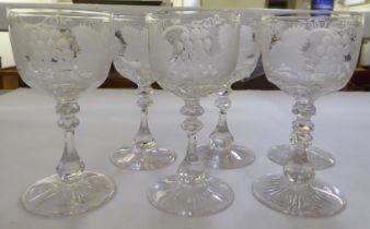 A set of six pedestal wine glasses, engraved with fruiting vine  5.5"h