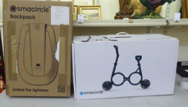 A Smacycle S1 folding electric bicycle and back pack  boxed