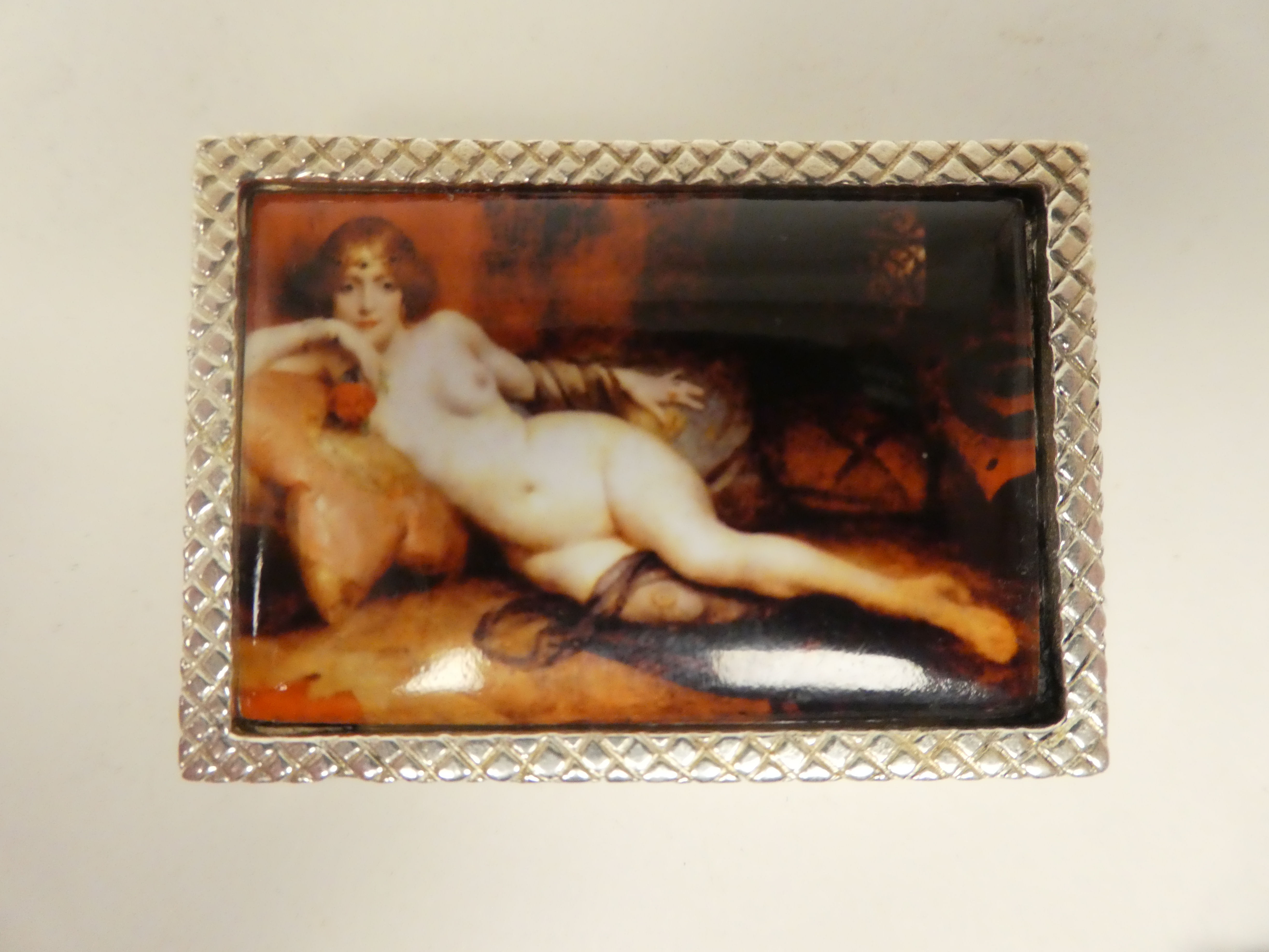A silver coloured metal pin box, the hinged lid featuring an enamelled study, a reclining nude - Image 2 of 4