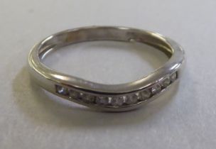 A 9ct white gold diamond set wedding ring