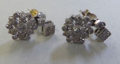 A pair of 18ct gold flower drop diamond earrings