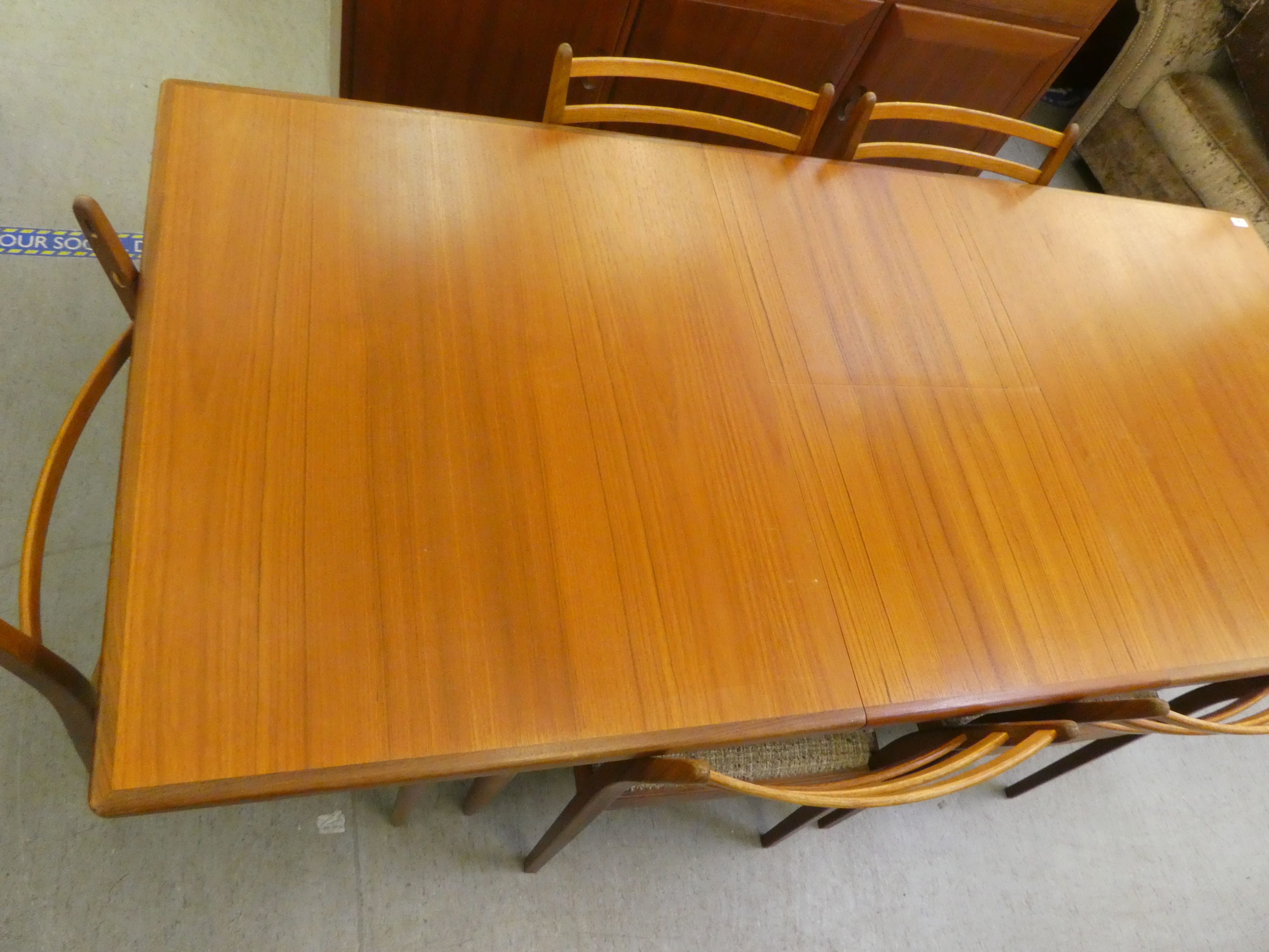 A 1970s teak G-Plan dining table, raised on turned, tapered legs  29"h  62"L extending to 80"L - Image 2 of 8