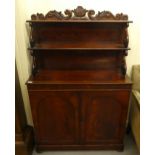 An early Victorian mahogany chiffonier, the two tier superstructure with scrolled supports, over a
