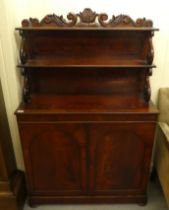 An early Victorian mahogany chiffonier, the two tier superstructure with scrolled supports, over a