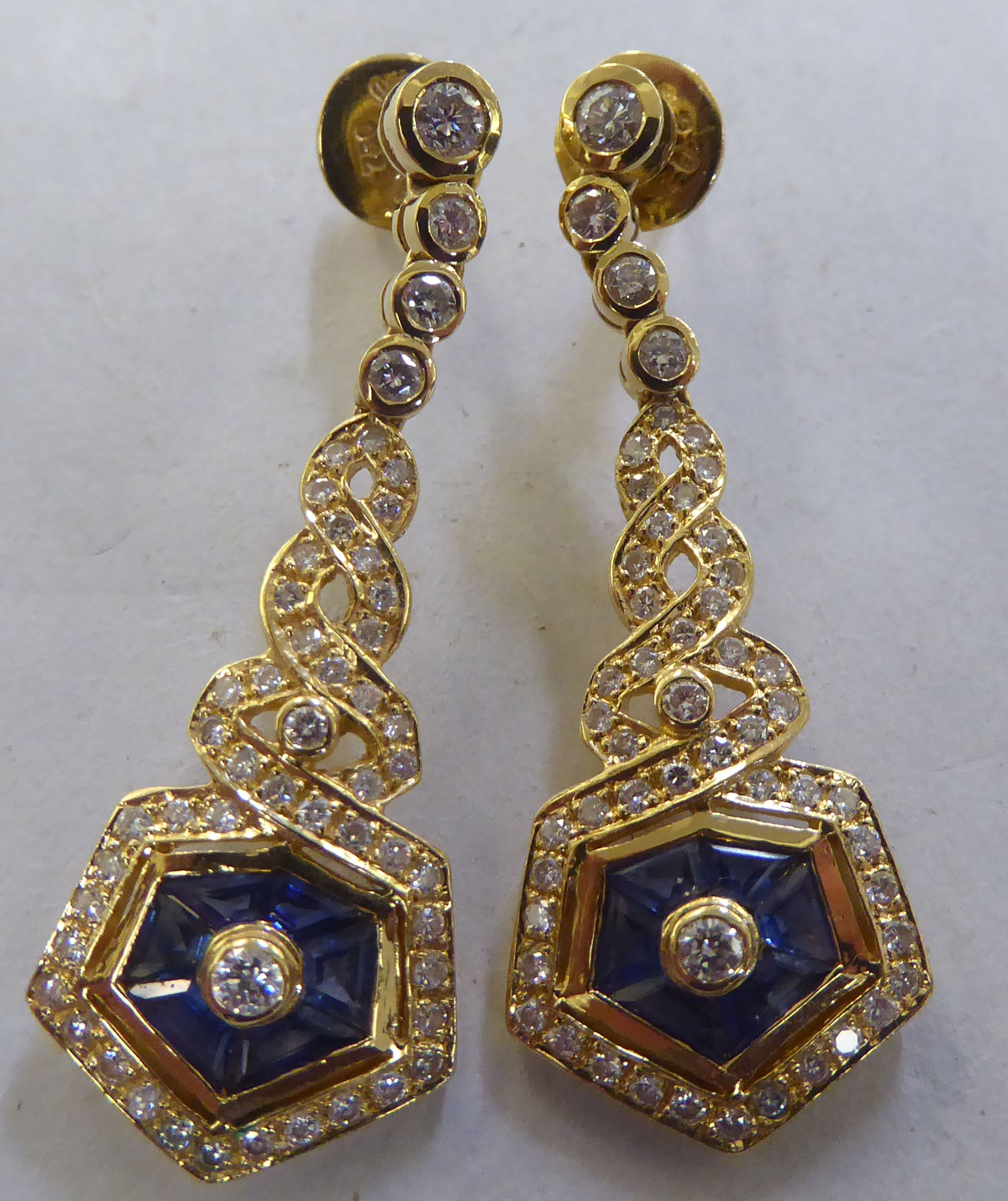 A pair of 18ct gold diamond and sapphire pendant earrings