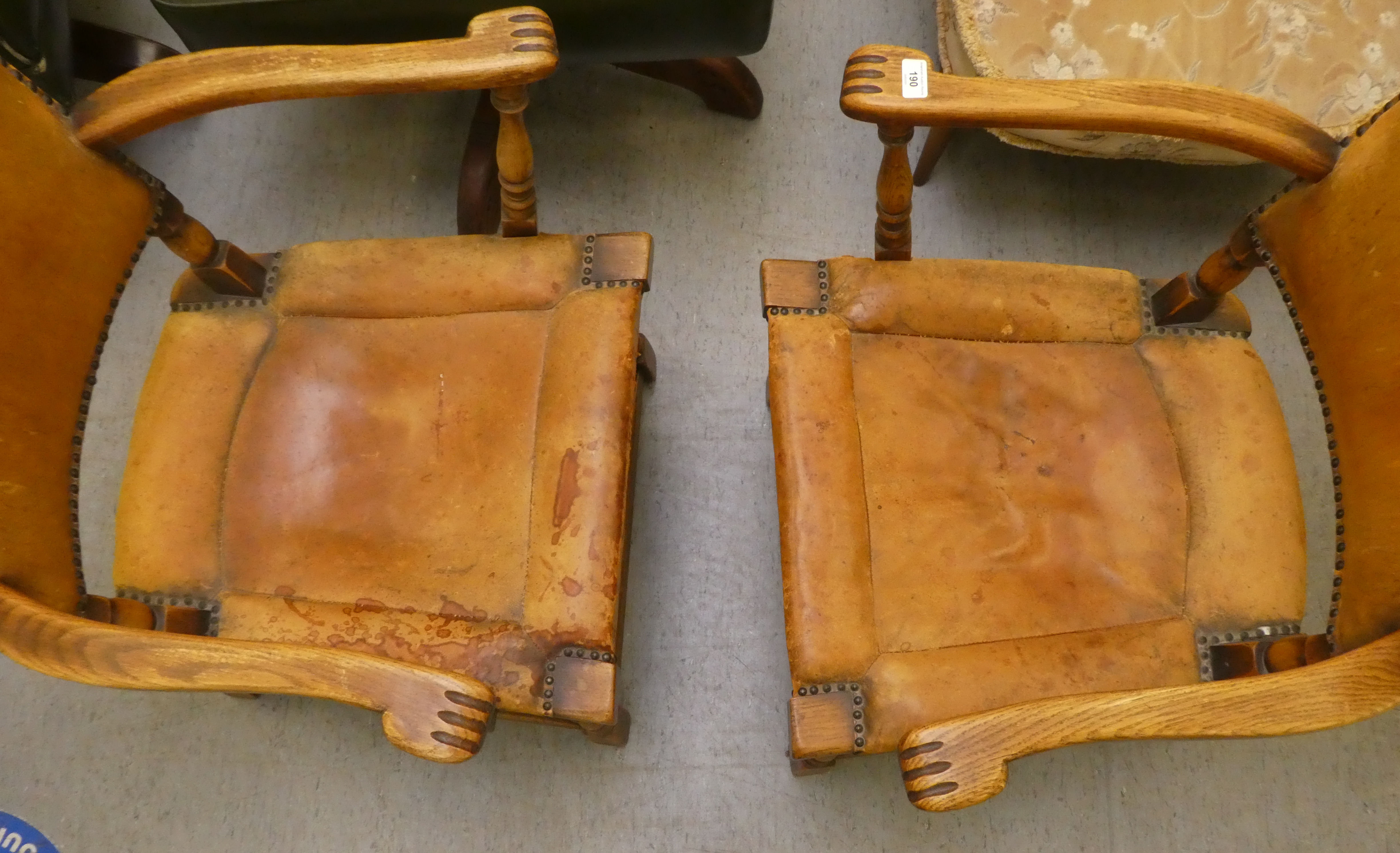 A pair of 1930w oak framed chairs with brown hide upholstered backs and seats, raised on block legs - Image 4 of 5