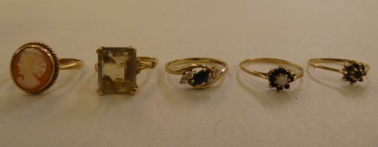 Five 9ct gold rings, variously set with coloured stones