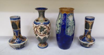 Four mainly early 20thC Royal Doulton Lambeth vases  all approx. 10"h