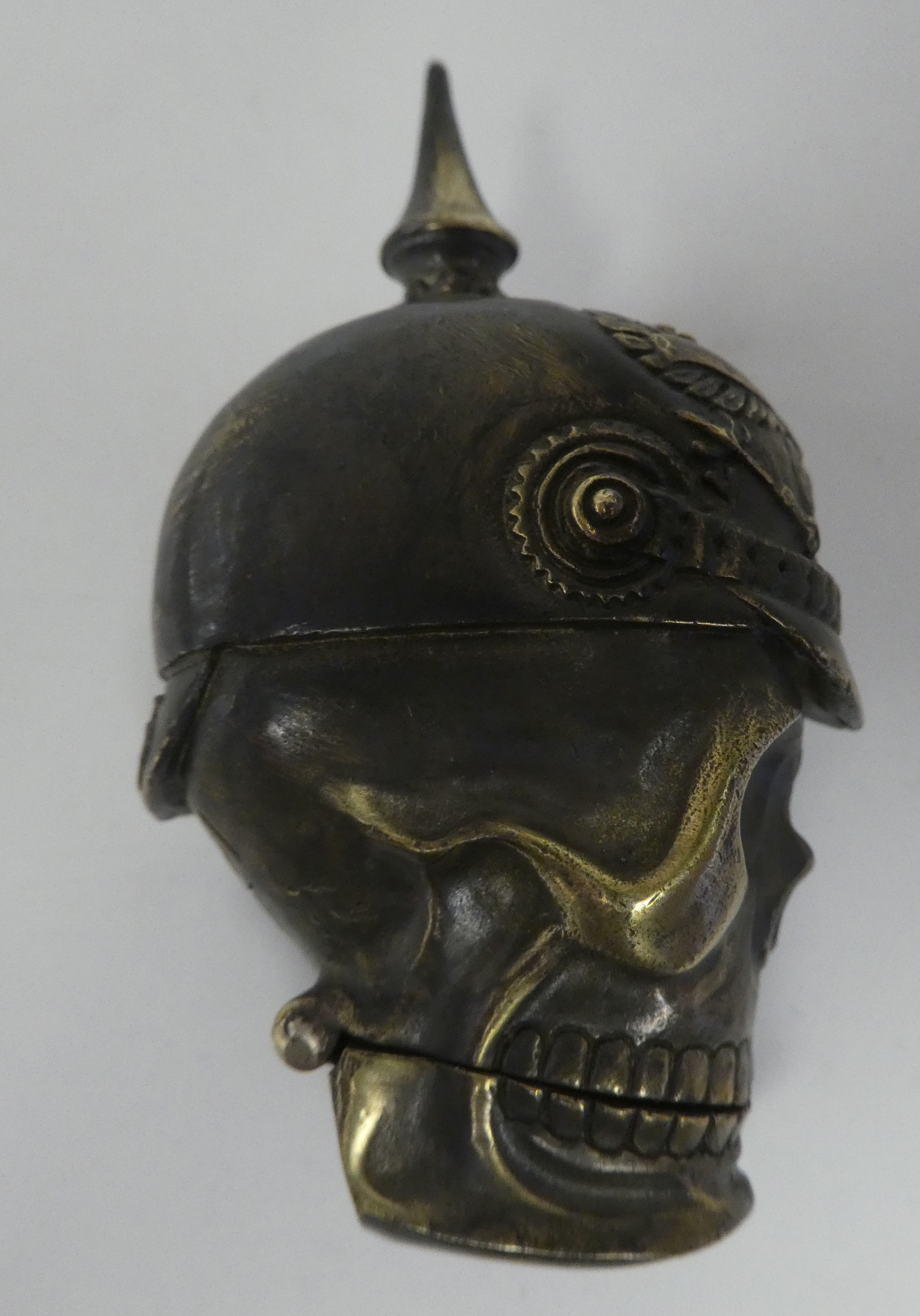 A brass vesta case, fashioned as a skull wearing a pickelhaube - Image 3 of 5