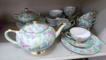 British Empire Chintz china Lilac Time pattern teaware, comprising a teapot, saucer, milk jug, cups,