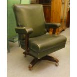 A mid 20thC faux green hide upholstered swivel office chair, raised on a splayed pedestal base