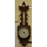 A mixed lot: to include an Edwardian oak barometer with a Roman and Arabic dial  34"h