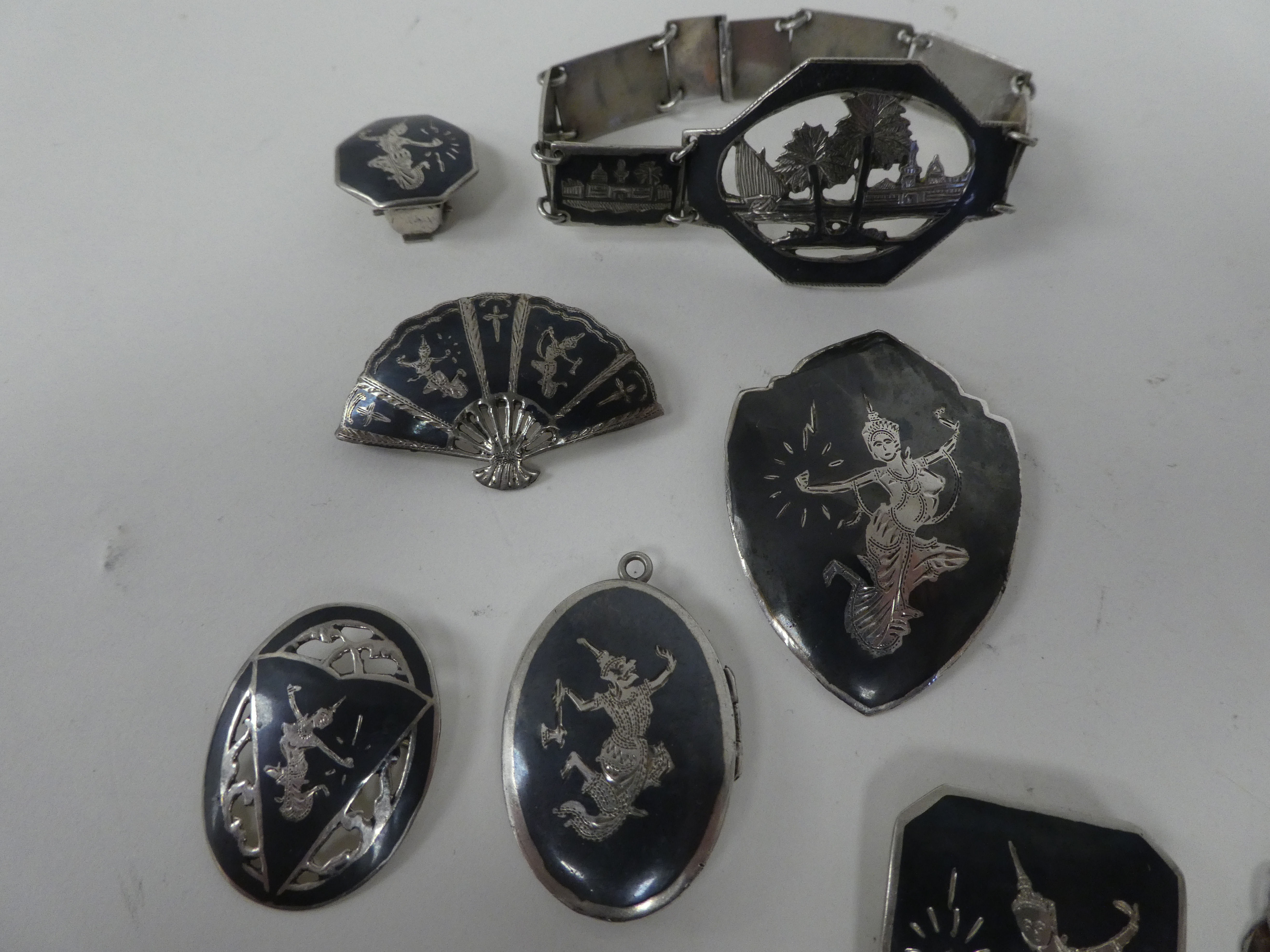 Asian silver, silver coloured metal and enamelled items of personal ornament: to include brooches; a - Image 3 of 9
