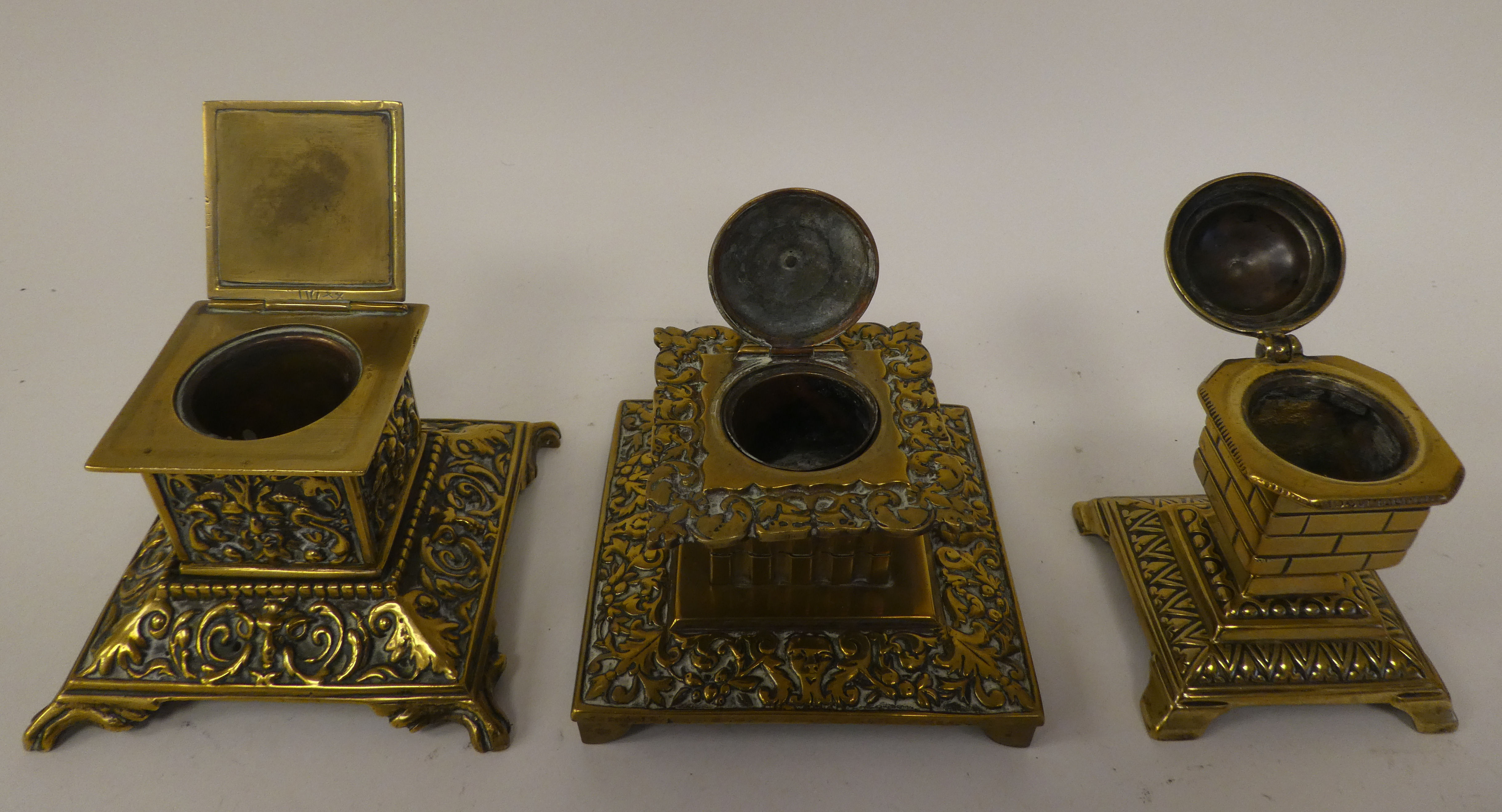 Six variously designed, early/mid 20thC decoratively cast brass desktop lidded inkwells - Image 4 of 4