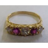 An 18ct gold diamond and ruby ring