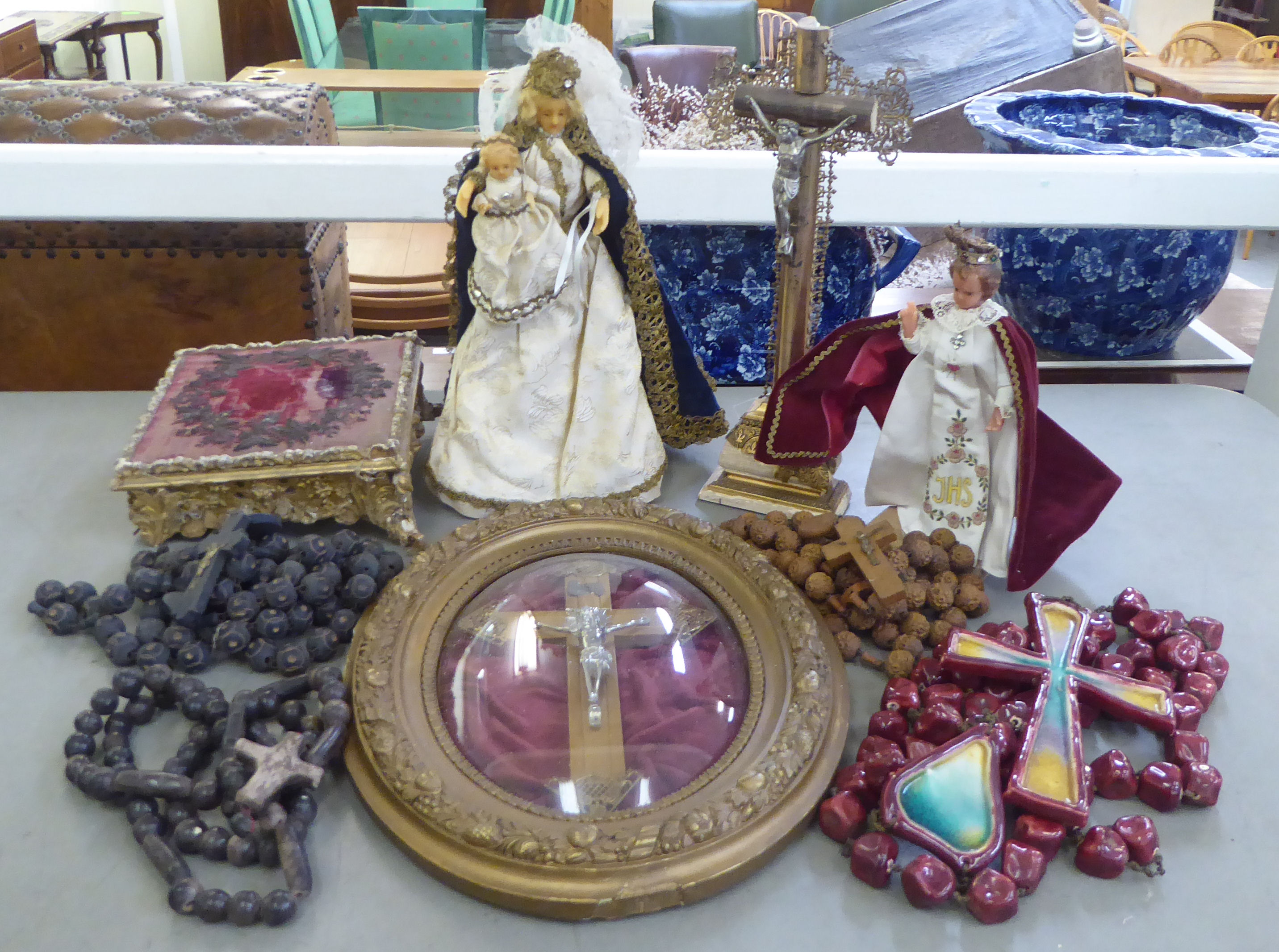 A mixed lot: to include a mixed media crucifix  15"h; and a Madonna and Child doll  13"h