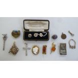 Items of personal ornament: to include a yellow metal cameo brooch; and pendant watch key