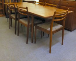A 1970s teak G-Plan dining table, raised on turned, tapered legs  29"h  62"L extending to 80"L