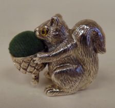 A silver novelty pin cushion, fashioned as a squirrel  stamped Sterling