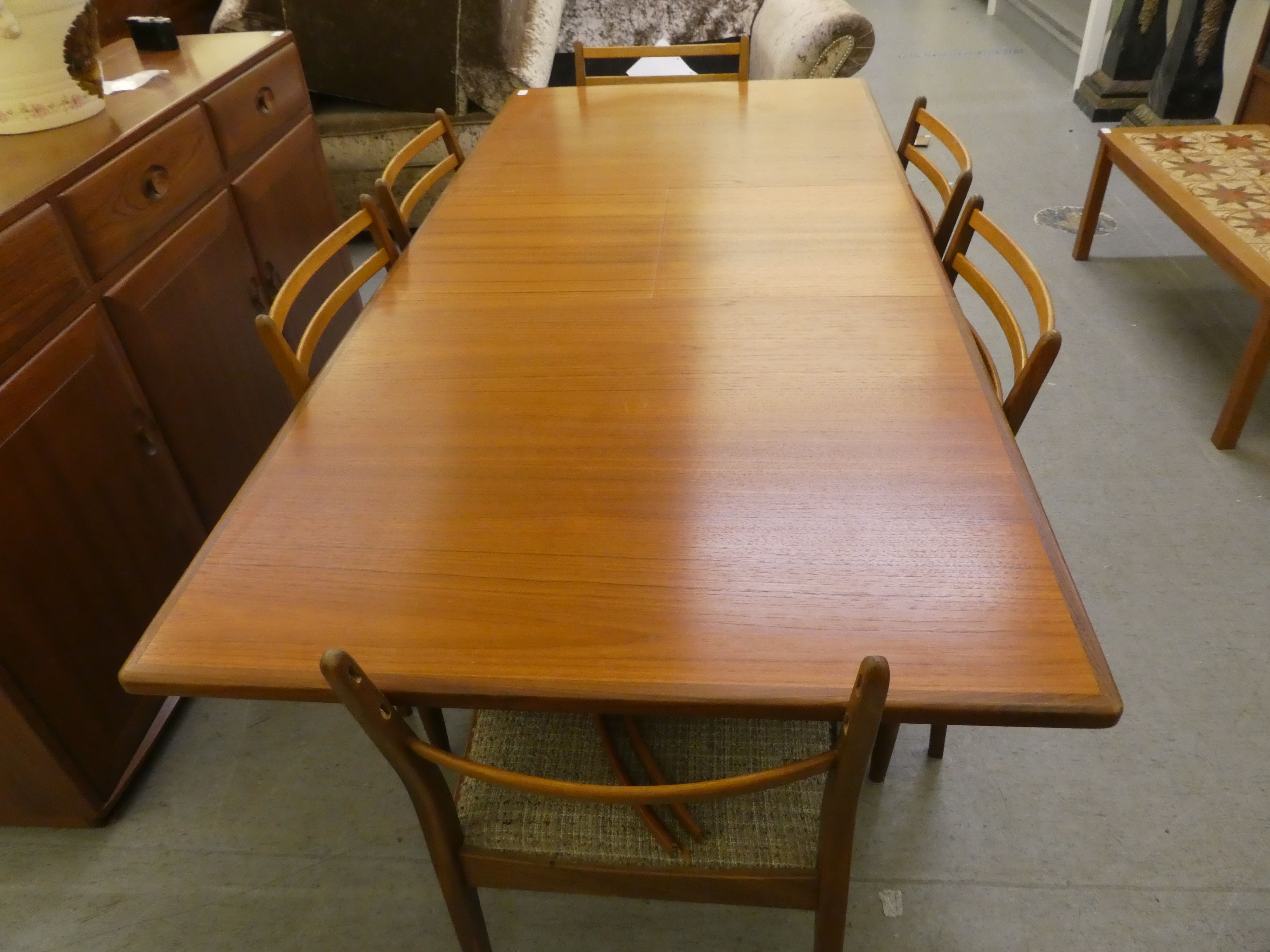 A 1970s teak G-Plan dining table, raised on turned, tapered legs  29"h  62"L extending to 80"L - Image 8 of 8