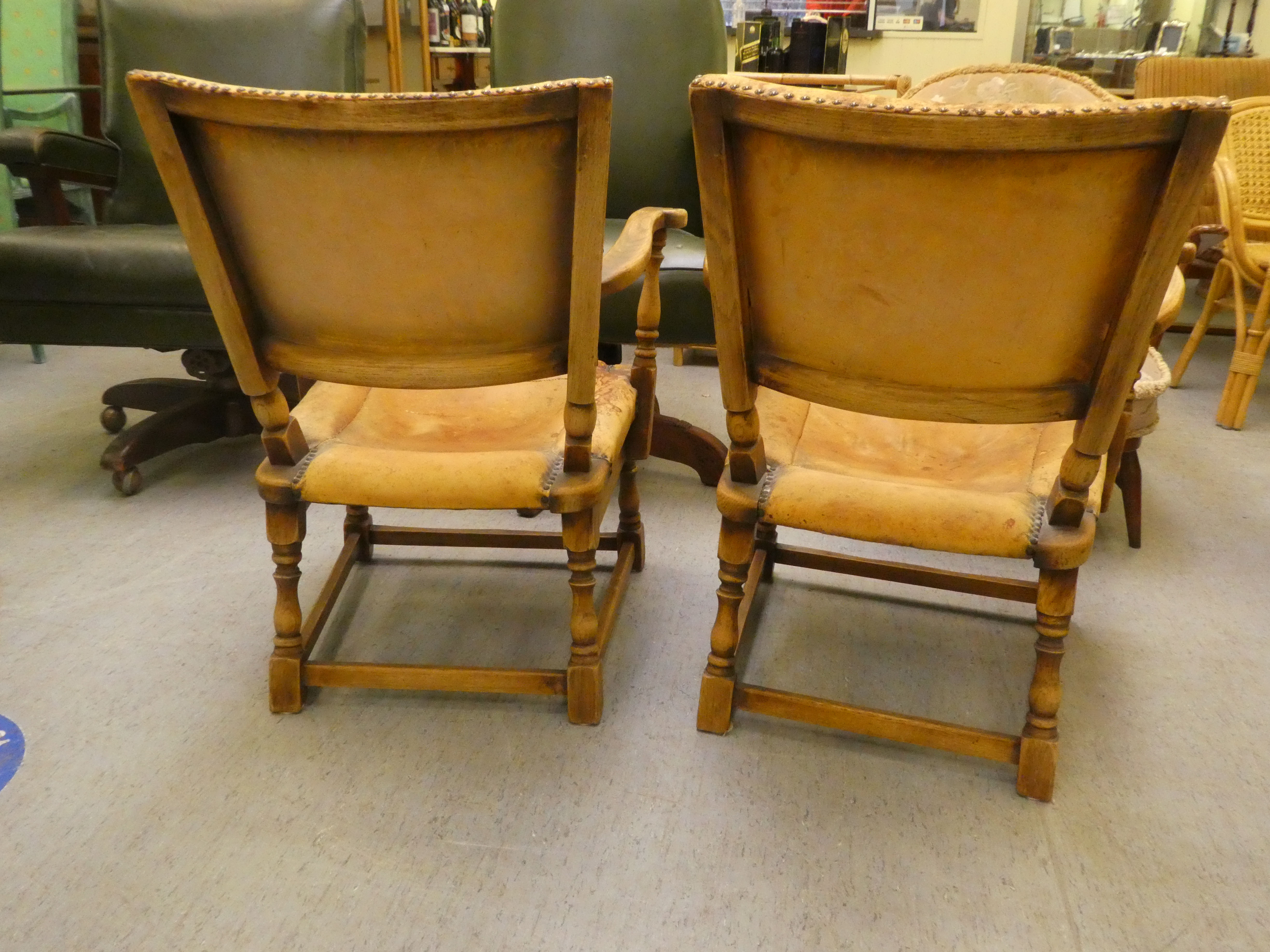 A pair of 1930w oak framed chairs with brown hide upholstered backs and seats, raised on block legs - Image 5 of 5