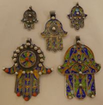 Five Hamsa white metal and multi-coloured enamel pendants