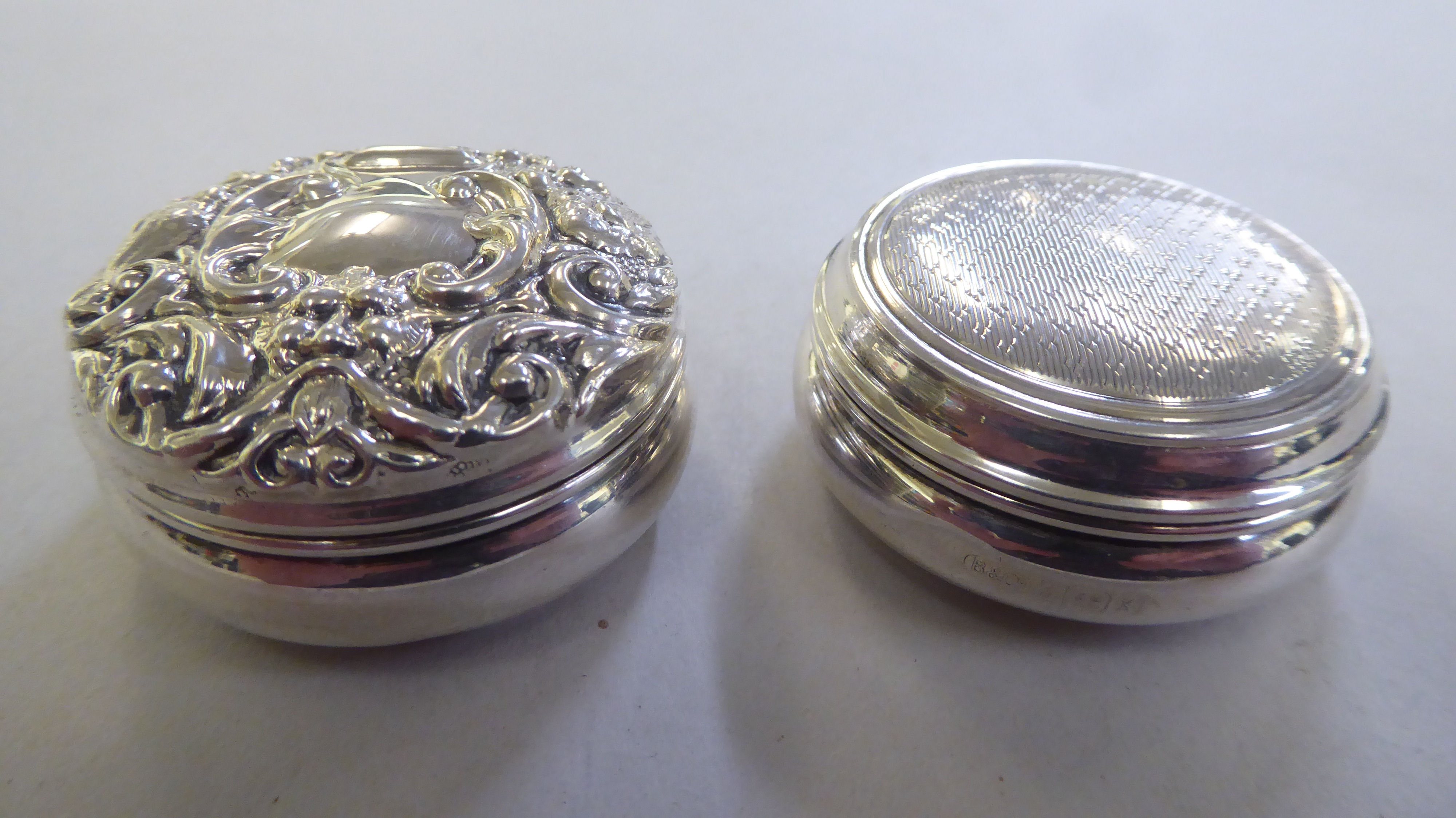 Two similar silver pill boxes  mixed marks