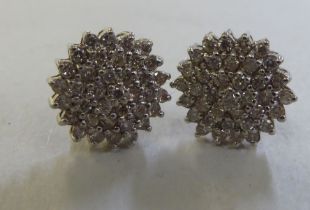 A pair of 9ct gold diamond cluster earrings