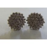 A pair of 9ct gold diamond cluster earrings