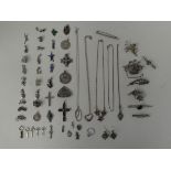 Silver, silver coloured and white metal items of personal ornament: to include brooches; pendants;