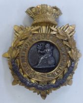 A Norfolk Regt. helmet plate  (Please Note: this lot is subject to the statement made in the