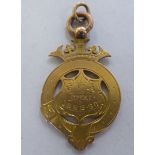 A late Victorian 9ct gold pendant football medal  1889