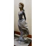 A Lladro porcelain figure of a girl, holding a book  15"h