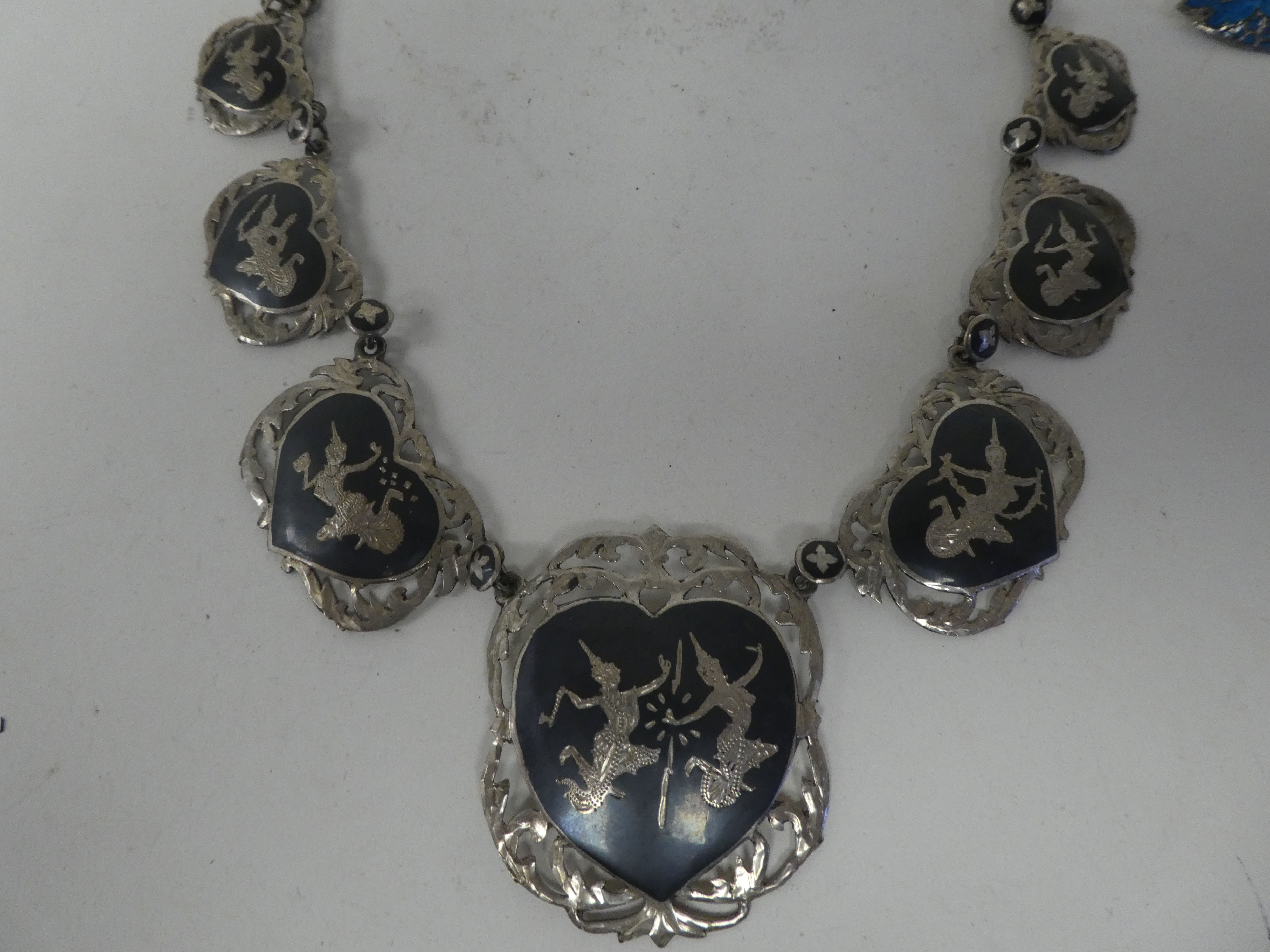 Asian silver, silver coloured metal and enamelled items of personal ornament: to include brooches; a - Image 8 of 9