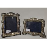 Two dissimilar, glazed, silver mounted photograph frames with embossed ornament, fabric backs and
