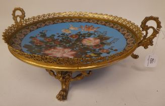 A 20thC cloisonné dish, in an ornately cast, gilded metal, twin handled frame carrier, decorated