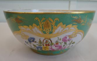 A Rockingham Works porcelain fruit bowl, decorated with flora and gilding  10"dia