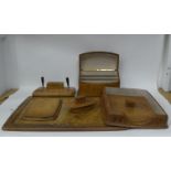 An Italian gilded and burnished mid-brown hide covered desk set, comprising a two-part blotter