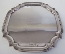 A silver salver with a raised piecrust border  Alexander Clark & Co  Birmingham 1950  12"sq  (