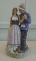 A Royal Copenhagen porcelain group, a courting couple, model no.3049  17"h