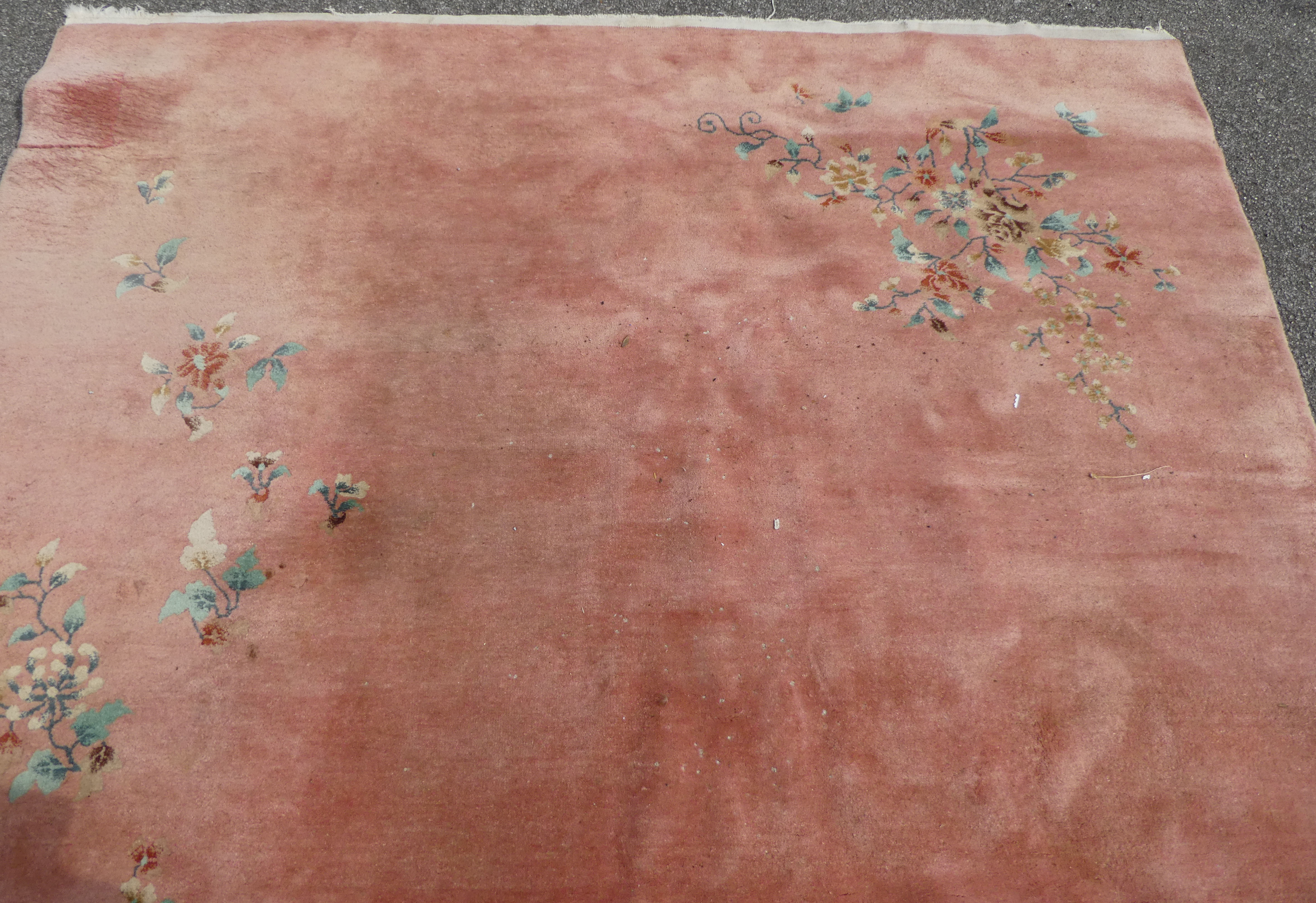 A Chinese washed woollen rug, decorated with flora, on a salmon pink coloured ground  100" x 148" - Image 2 of 7