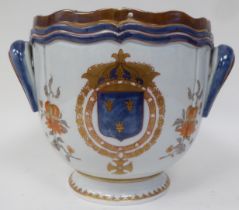 A Samson porcelain jardinière with a wavy rim and twin handles, on a deep footrim,