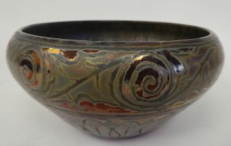 A Clemont Masier Art glass bowl of bulbous form with an inverted rim, decorated with scrolled and