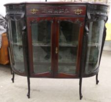 An Edwardian mahogany credenza with a breakfront, bowed sides and glazed panels, enclosing two