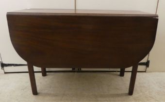 A George III mahogany drop-leaf table, raised on square legs  28"h  41"w