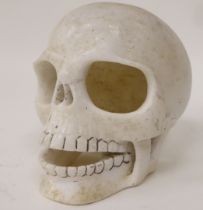 A carved white marble primates skull  5.5"h